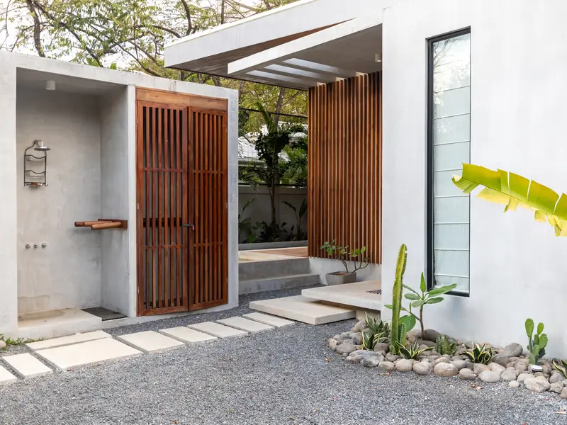 Private teak entry gate at Kirana Nosara