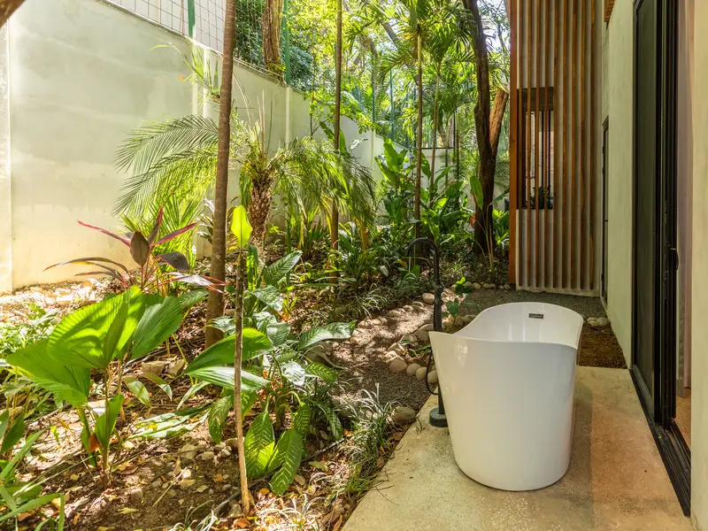 Outdoor soaking tub in Kirana Nosara's private jungle garden