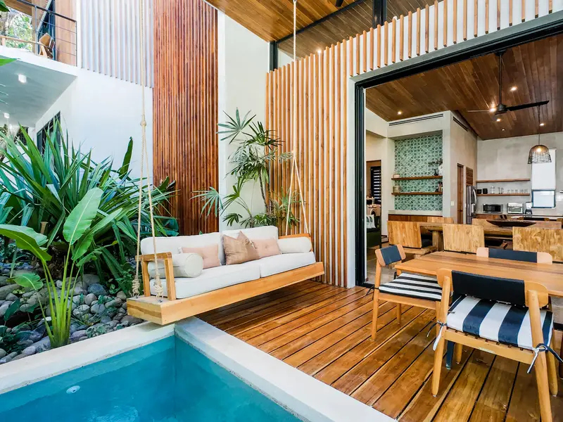 Pool and swing daybed looking into the open kitchen