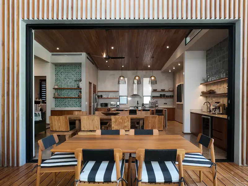 View from the covered terrace across the pool into the dining room