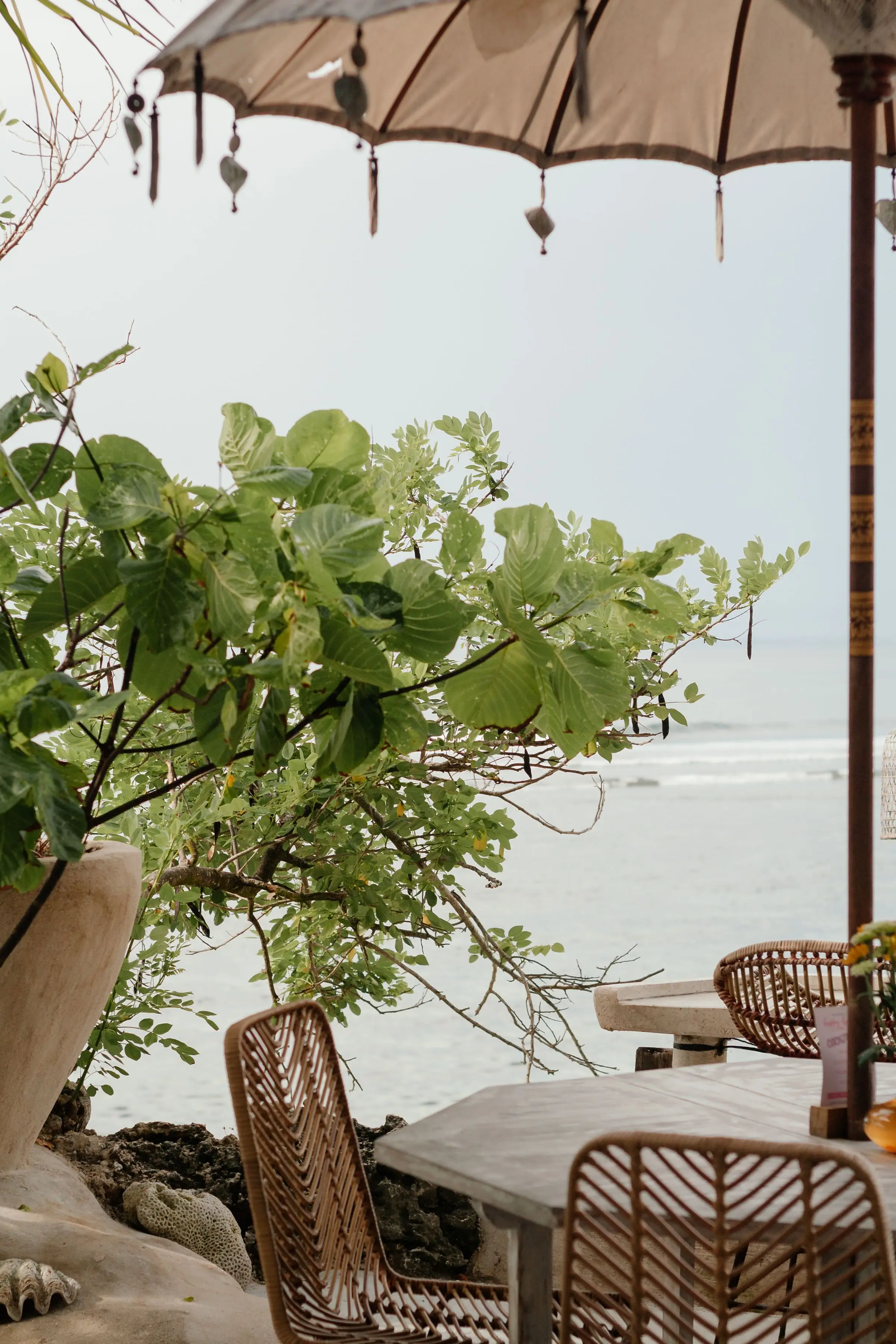 Tropical seaside café with wicker furniture and ocean view